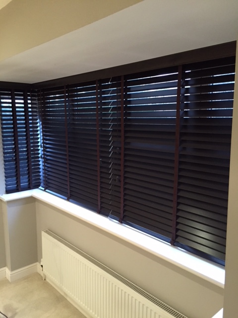 Attractive venetian blinds fitted in a square bay window