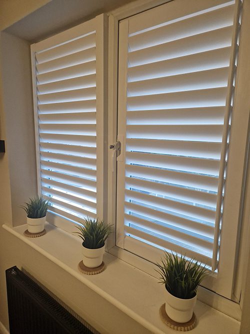 Perfect Fit shutters installed on a modern living room window
